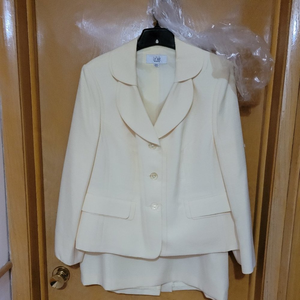 Two piece ladies suit with flip skirt and ruffle collar